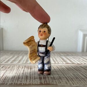 Charming Boy Figurine with Scroll